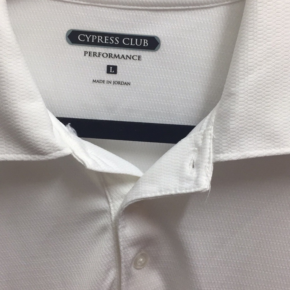 White performance polo by Cypress Club